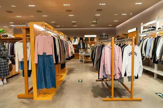Apparel displayed on racks inside I.T store at KK Mall