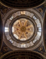 Obraz premium Ornate baroque dome interior with central oculus and natural light