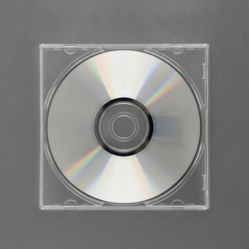 Close-Up of a Blank CD in a Transparent Case on a Gray Background