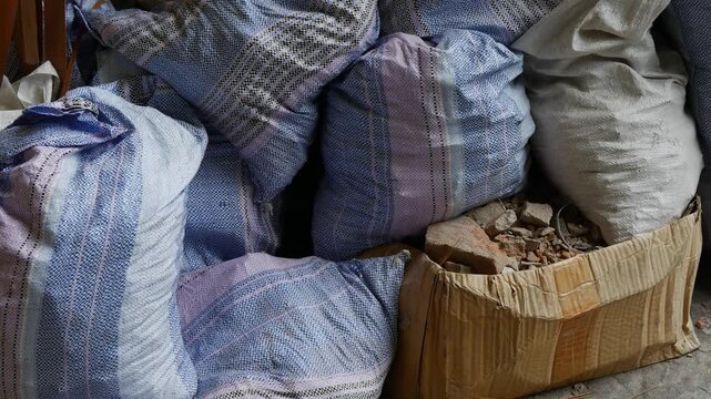 Construction Waste Bags and Rubble Cardboard Box on Ground Urban Renovation Scene