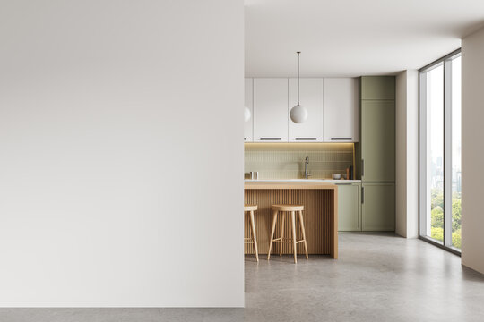 Empty interior featuring wide blank wall beside modern kitchen with stools and daylight windows, ideal for poster mockup and copy space template. 3D Rendering