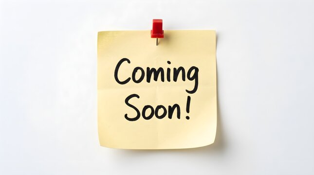 Yellow adhesive paper note featuring the words coming soon attached by a red plastic pin