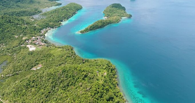 Aerial view of island with a lagoon and a beach in the tropics. Weh Island. Indonesia.