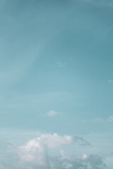 Obraz premium Blue sky background with soft wispy clouds, abstract nature texture with copy space