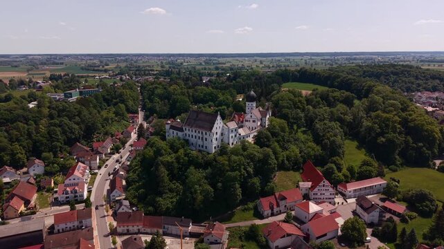 Aerial view of Illertissen, Bavaria, Germany, featuring Voehlinschloss on the hill and the surrounding town in the Schwaben region, Neu Ulm district