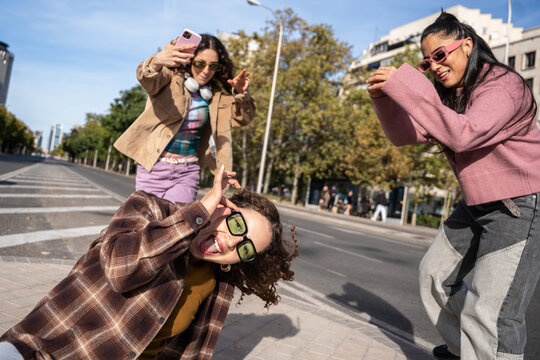 Gen-Z urban female dancer posing for street photo