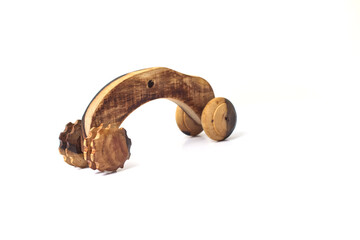 Fototapeta premium Handcrafted Wooden Toy Car with Rustic Texture on White Background