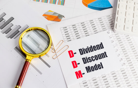 Dividend discount model concept with financial reports, magnifying glass, calculator and business charts representing stock valuation,