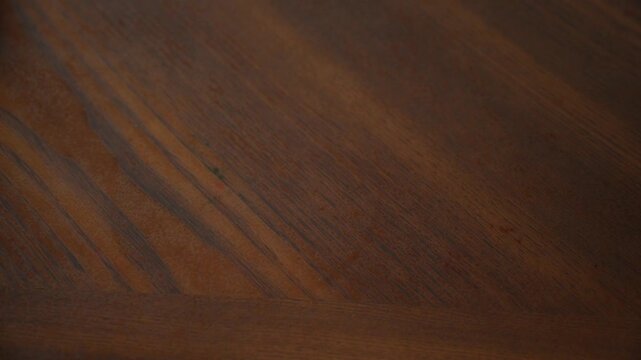 Female hand pushes back pills, capsules, vitamins, drugs in blisters on light wooden table, concept refusing to take drugs, maintaining health, pharmaceutical market, deliberate drug overdose