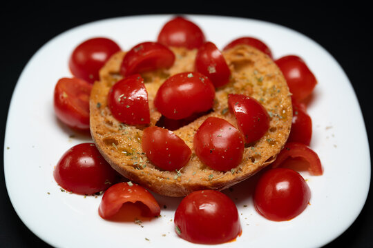 Fresella with cherry tomatoes, oregano, and extra virgin olive.