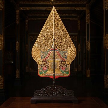 Traditional Golden Javanese Gunungan Wayang Mounted on Carved Wooden Stand inside Javanese House
