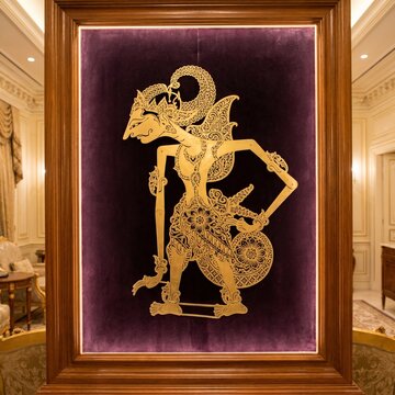 Majestic Golden Javanese Wayang Kulit Art Framed in Velvet Purple Fabric Background