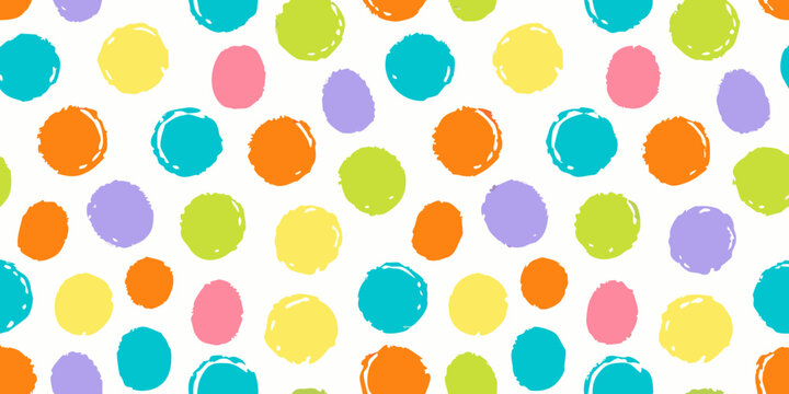 Colorful confetti dot pattern on a white background