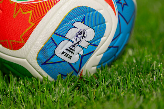 Calgary, Alberta, Canada. June 20, 2026. Macro shot of the official 2026 FIFA World Cup soccer ball resting on green grass pitch.