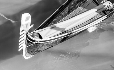 Black and white close up of a traditional Venetian gondola prow on the water in Venice Italy © ChiccoDodiFC
