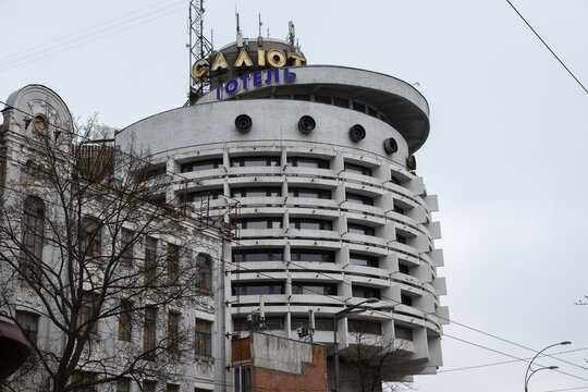 Kyiv, Ukraine - March 22, 2026: Salyut Hotel exterior with circular design architecture features, showcasing distinctive Soviet modernist building style in a somber urban landscape