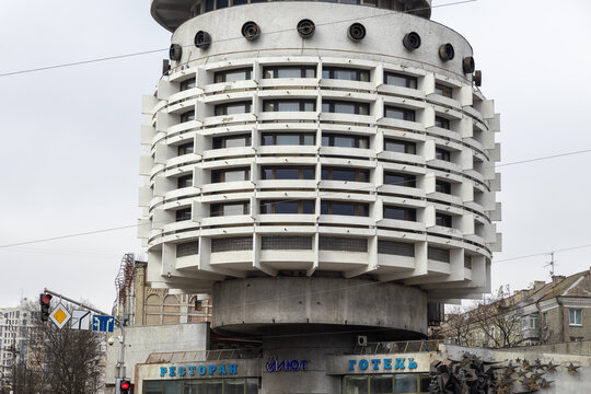 Kyiv, Ukraine - March 22, 2026: Salyut Hotel displays Brutalist architecture with a distinct cylindrical design featuring repeating white balcony tiers under a cloudy gray morning sky