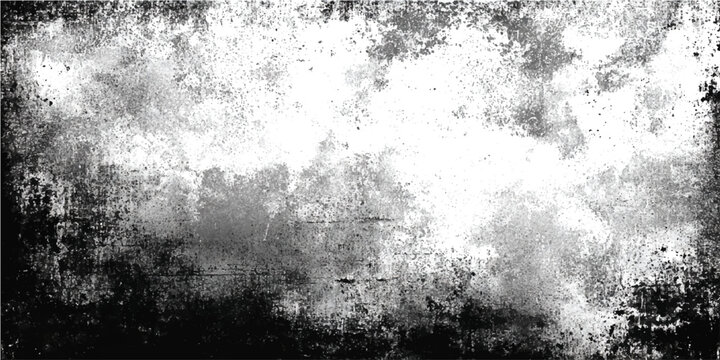 Abstract grunge texture of black and white paint splatters and distressed vintage paper effect with distressed border creating an artistic and chaotic backdrop.