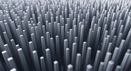 Fototapeta premium A dense field of vertical gray square pins or pillars of varying heights, creating an abstract metallic background