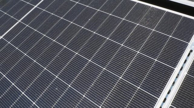 The Concept of Green Energy in an Urban Environment. Solar panels on the roofs of old apartment buildings. A rooftop solar power plant.