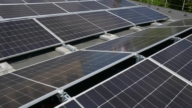 The Concept of Green Energy in an Urban Environment. Solar panels on the roofs of old apartment buildings. A rooftop solar power plant.
