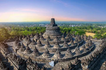 Tourist visiting in ancient largest Buddhist Borobudur Temple in Java Indonesia. © tawatchai1990