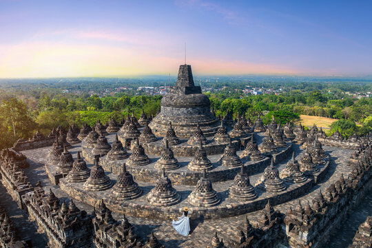 Tourist visiting in ancient largest Buddhist Borobudur Temple in Java Indonesia.