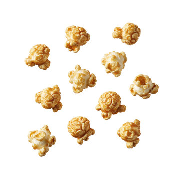 Airy, crunchy caramel popcorn kernels with unique craggy textures and golden-brown glaze, floating against a transparent background, suggesting a playful explosion of flavor