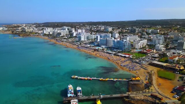 Aerial Drone View of Protaras Cyprus, Luxury Beachfront Hotels, Golden Sandy Beach and Crystal Clear Mediterranean Sea