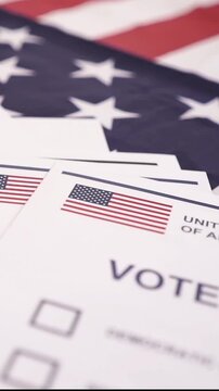 A U.S. citizen holding a ballot at a polling station during the U.S. Congressional midterm elections