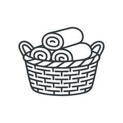 Obraz premium Rolled towels in a basket.