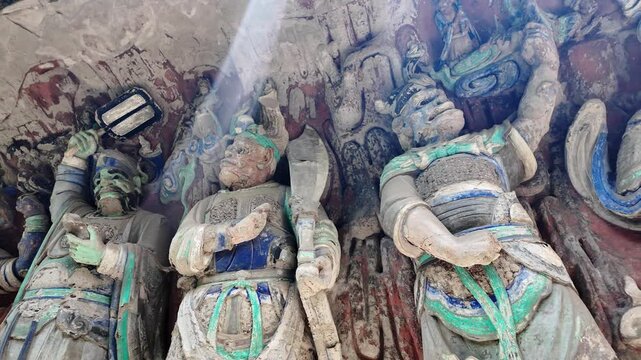 Dazu, China: Panoramic footage of ancient statues, part of Baodingshan grottoes in Dazu rock carvings, famous rock art in Chongqing, China