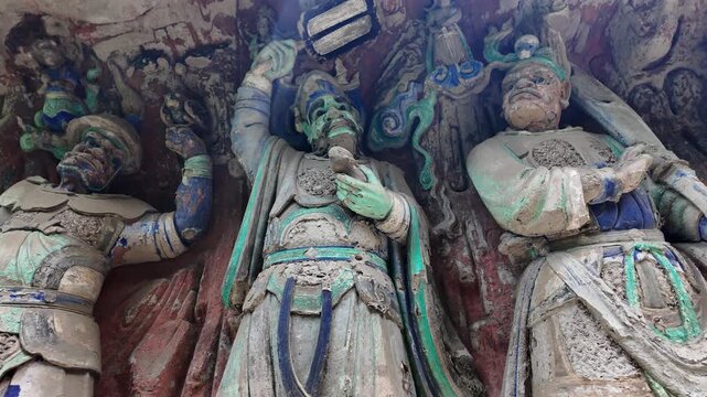 Dazu, China: Panoramic footage of ancient statues, part of Baodingshan grottoes in Dazu rock carvings, famous rock art in Chongqing, China