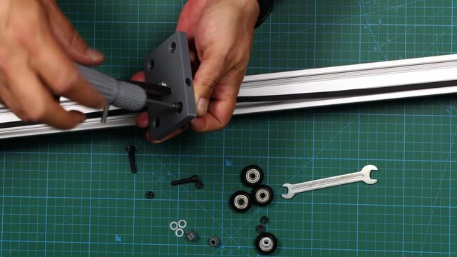 Assembly of 3D Printed Parts, Aluminum Profiles and Bolts for Camera Slider Construction, Precision Engineering, Mechanical Assembly, DIY Prototyping, Industrial Manufacturing and Technical Demonstrat