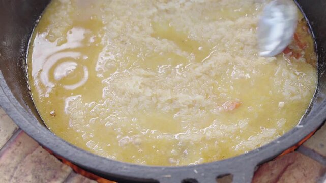 Leveling Rice and Covering Cauldron with Lid