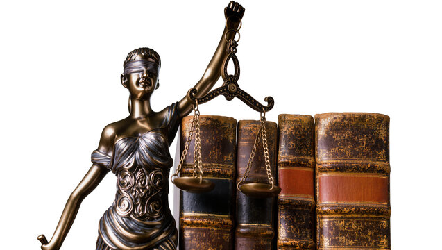 Isolated Lady Justice statue holding scales next to antique law books, symbolizing legal system.