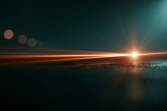 Cinematic Lens Flare Background With Orange Light Streak And Moody Teal Bokeh