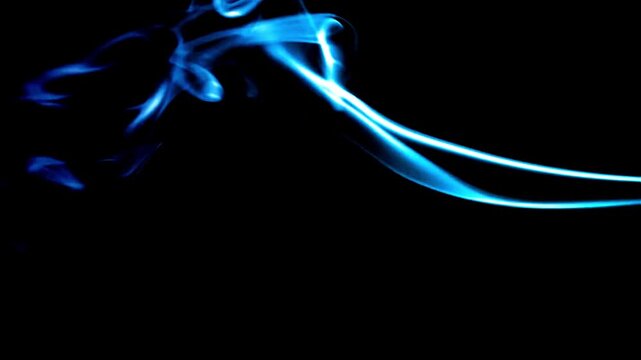 Blue smoke wisps flow smoothly across a black background in a seamless abstract motion loop animation.