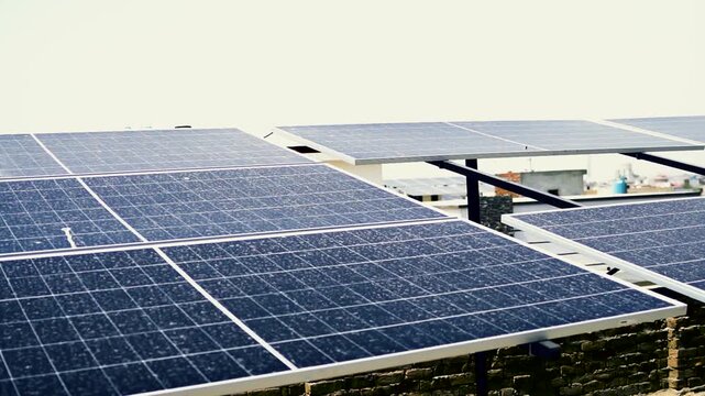 Array of solar panels installed on rooftop for renewable energy sustainable electricity power sun photovoltaic