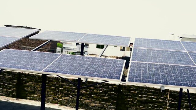 Modern solar panels on residential roof for sustainable energy production renewable rooftop power electricity photovoltaic