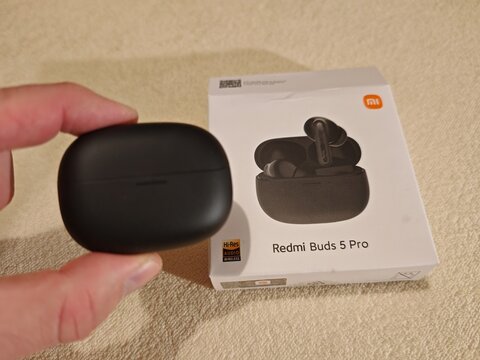 Prague,Czech Republic-April 2 2026: Redmi Buds 5 Pro wireless earbuds displayed with open charging case and retail packaging