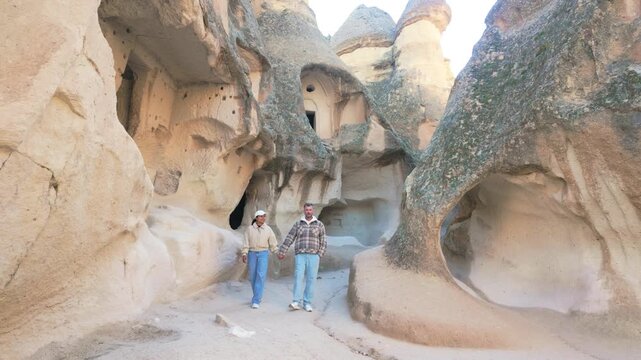 Explore the breathtaking landscapes of Cappadocia, Turkey, as you wander through unique rock formations. Experience the stunning natural beauty and rich history of this remarkable location.