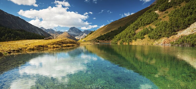Small mountain lake on the Albula Pass in autumn, Canton Graub&uuml;nden, Switzerland