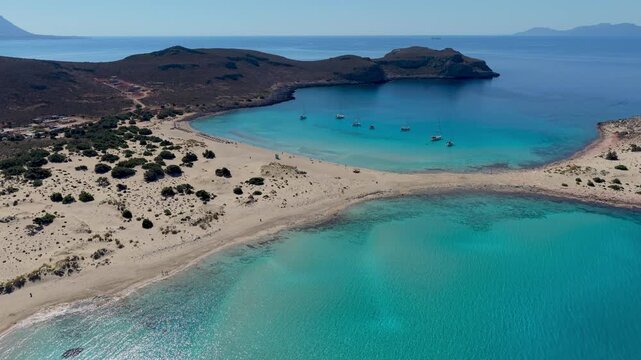 Bask in the crystal-clear waters and golden sands of Simos Beach, a hidden gem in Elafonisos, Greece. Experience a perfect day under the sun in this serene paradise.