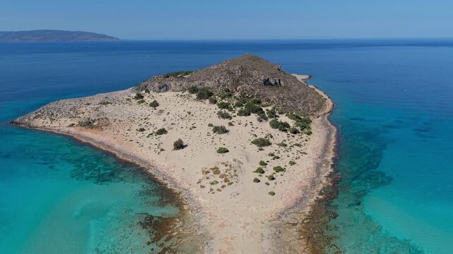 Experience the breathtaking landscape of Simos Beach, where soft sands meet turquoise waters on Elafonisos Island. A tranquil escape for sun seekers and nature lovers alike. Elafonisos Island Greece