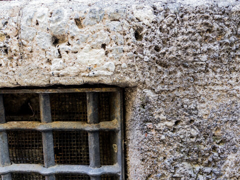 old window in a stone wall