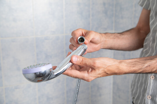Man repair and installing a shower head.
