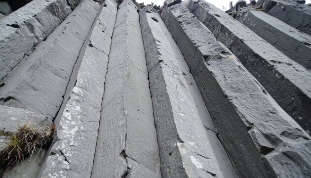 Towering Hexagonal Basalt Columns in Nature, Showcasing Geological Formations and Natural Artistry