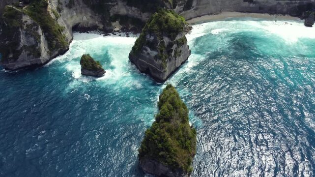 Aerial view of the iconic limestone sea stacks at Diamond Beach in Nusa Penida, Bali