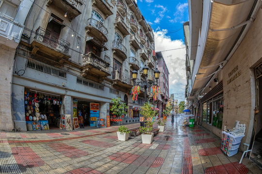 SANTO DOMINGO, DOMINICAN REPUBLIC - MARCH 13, 2020: Small souvenir shops located on the picturesque street Calle Arzobispo Merino, in the historical center of the city.